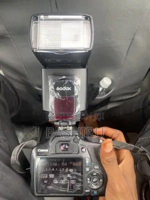 Canon EOS 1200D DSLR Camera with 55-250mm Lens & Speedlight