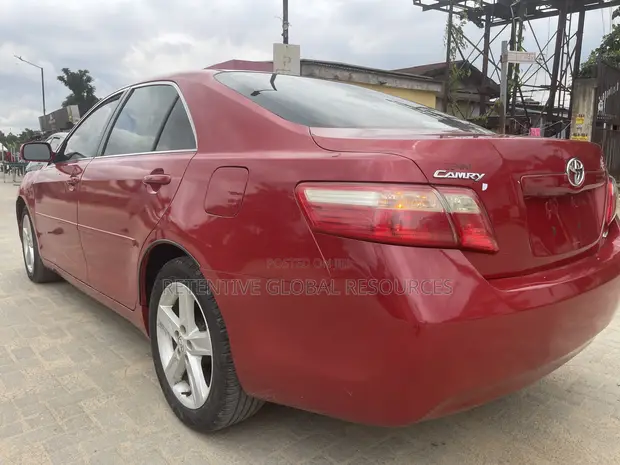 2009 Toyota Camry LE Red - 1
