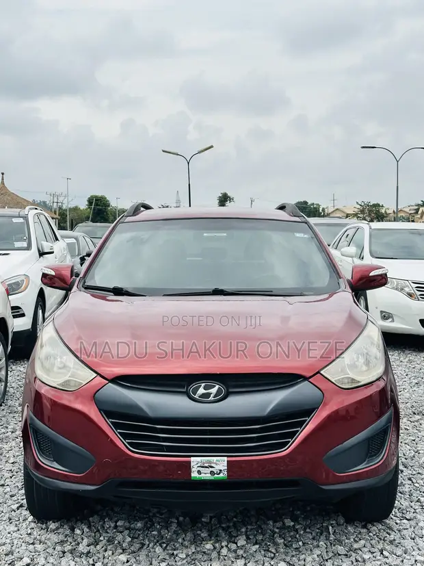 2015 Hyundai Tucson SE AWD Red - 1