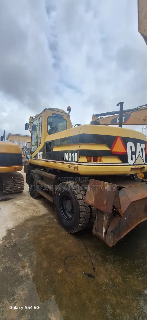 Caterpillar M318 Wheel Excavator - 1