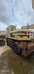 Caterpillar M318 Wheel Excavator - 1