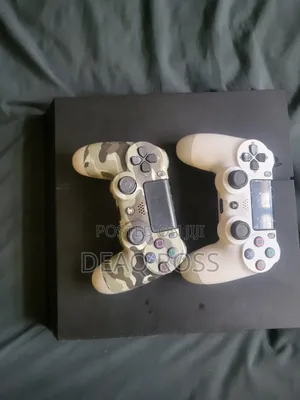 PS4 Console with 2 Controllers and 6 Games