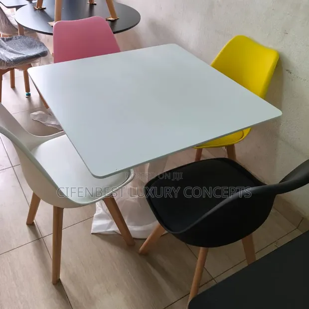 White Restaurant Dining Table with 4 Colored Chairs - 1
