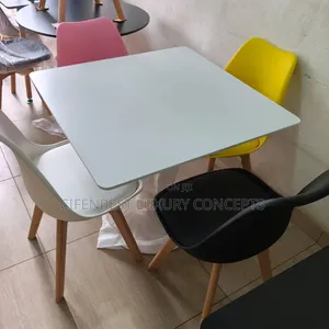 White Restaurant Dining Table with 4 Colored Chairs