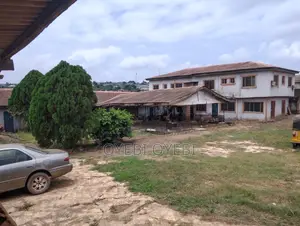 Hotel Building on Two Plots of Land with Shops
