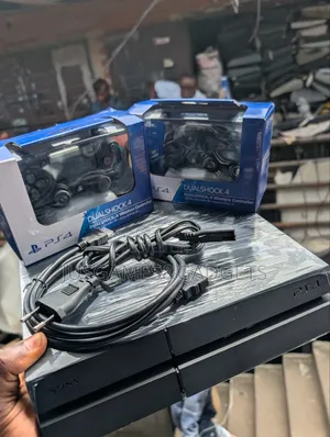 PlayStation 4 (PS4) with 2 Controllers & Games