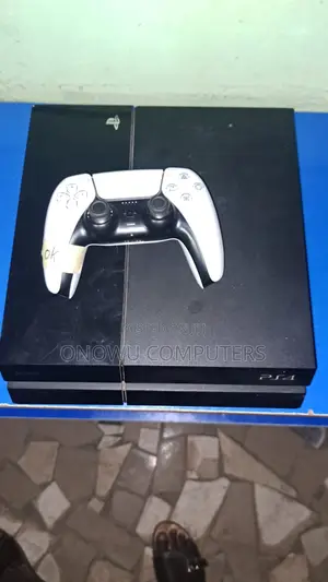 Used PS4 Fat Hacked with 2 Controllers & Accessories