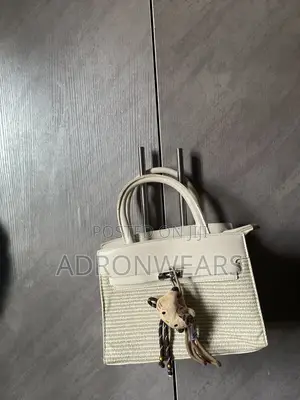 Adron Wears Black Birkin-Style Handbag
