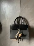 Adron Wears Black Birkin-Style Handbag - 3