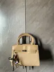 Adron Wears Black Birkin-Style Handbag - 4