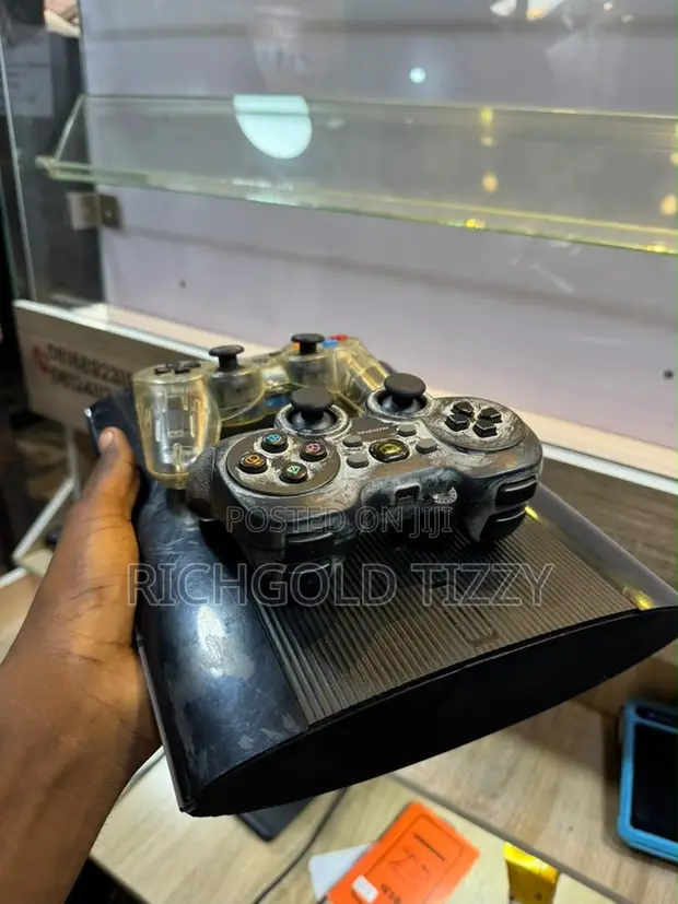 Sony PS3 Slim with 2 Controllers - 1