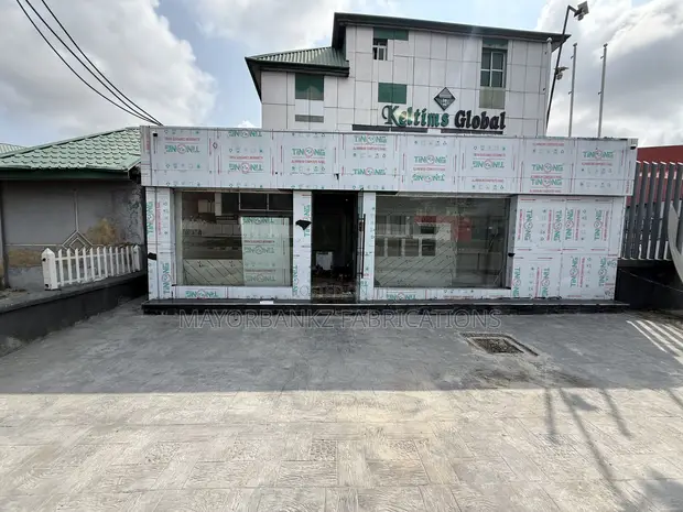 Board Cladding with Frameless Swing Door Installation - 1
