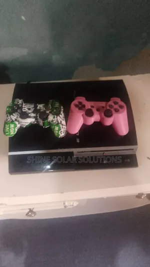 PS3 with 2 Controllers and 4 Games
