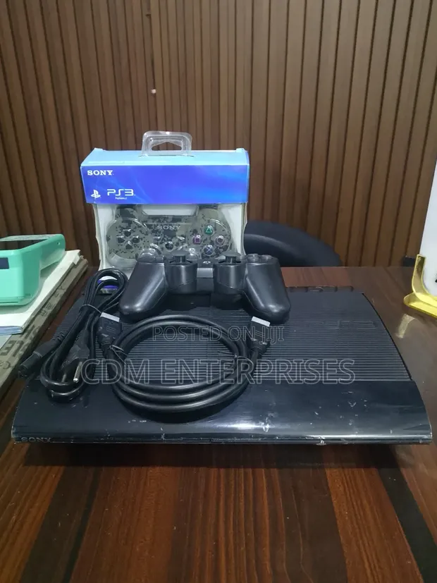 Used UK PS3 Super Slim Console with 25 Games & 2 Controllers - 1