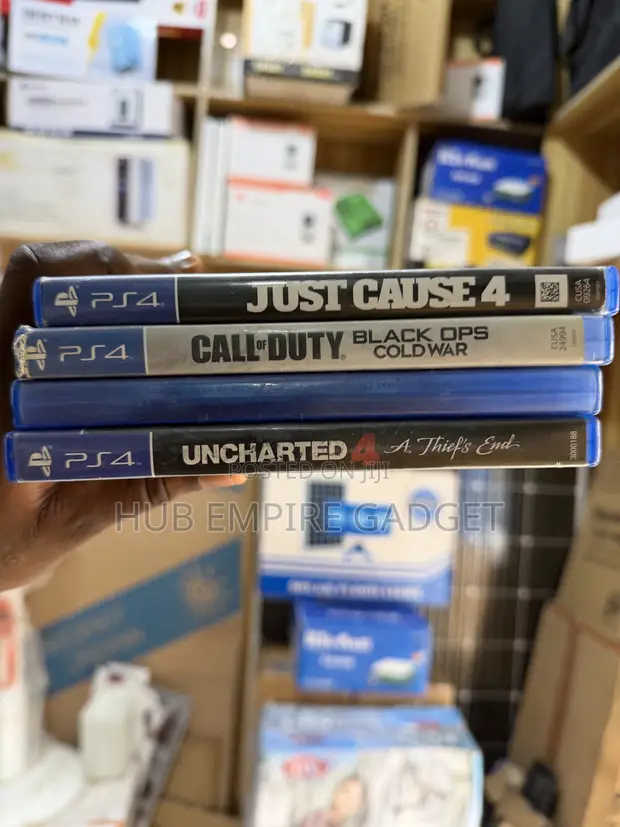 Used Sony PlayStation 4 (PS4) with 1 Controller & 4 Games - 1