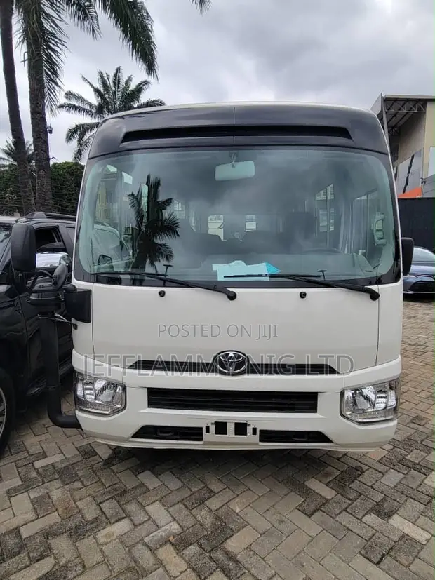 New Toyota Coaster 2025 White - 1