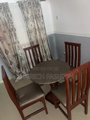 Used 4-Seater Wooden Dining Table with Chairs