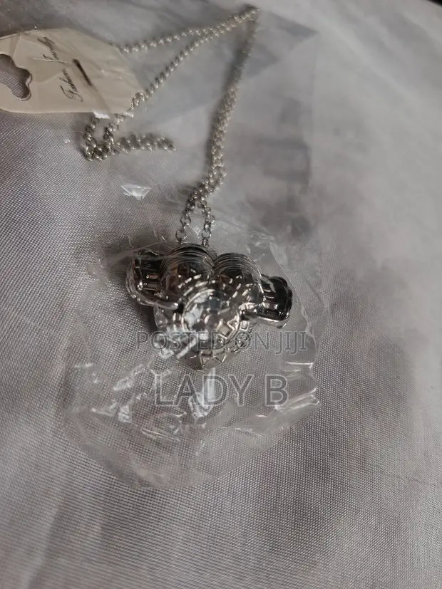 Silver Heart Shaped 4-Photo Folding Locket - 1