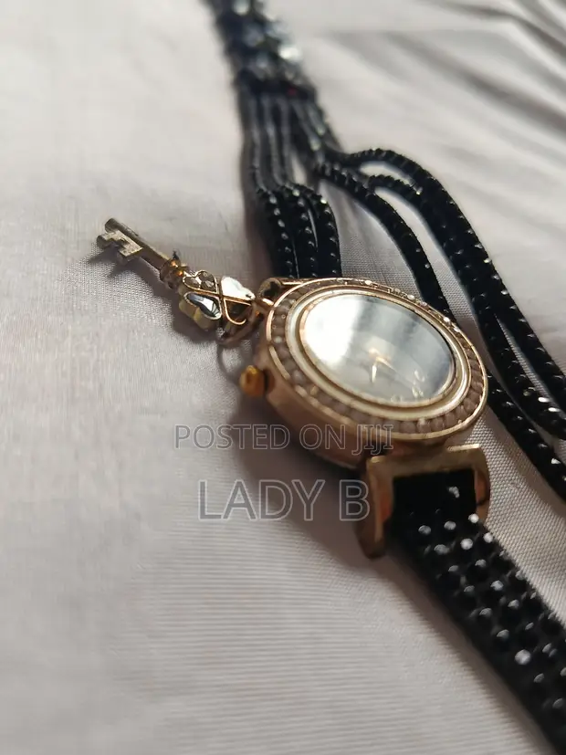 Elegant Black Watch with Gold Clover-Key Charm - 1