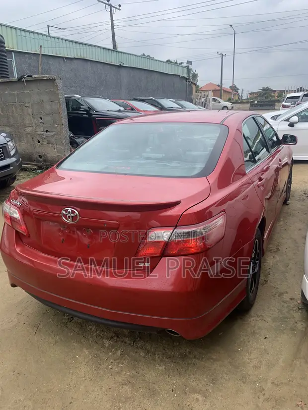 2009 Toyota Camry SE V6 Sedan - Red - 1