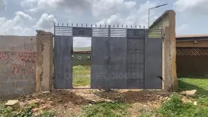 Two and Half Plots of Land with 11 Shops, Shagari Estate