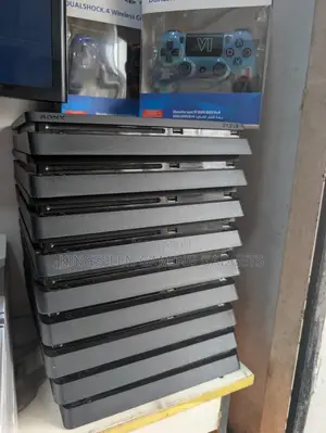 Used UK PS4 Slim Console with 2 Controllers and Games