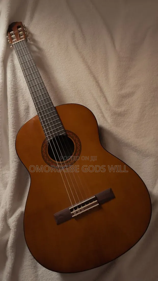 Barely Used Yamaha 38" Brown Acoustic Guitar with Bag - 1