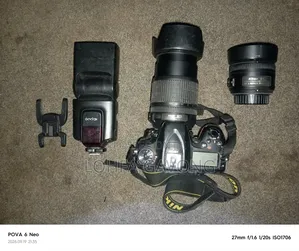 Nikon D7100 DSLR Camera with 18-105mm and 35mm Lenses, Speedlight