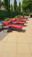 Rattan Poolside Bed with Cushion and Side Stool - 1
