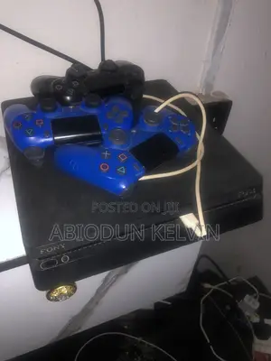 PlayStation 4 with 3 Controllers & Games