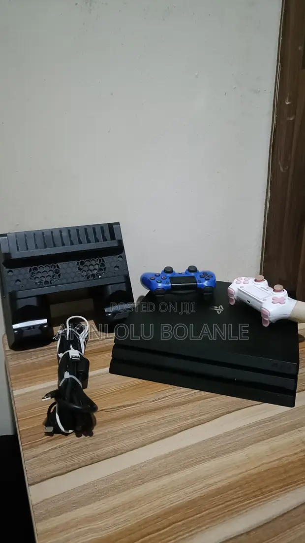 PlayStation 4 Pro with Two Controllers - 1