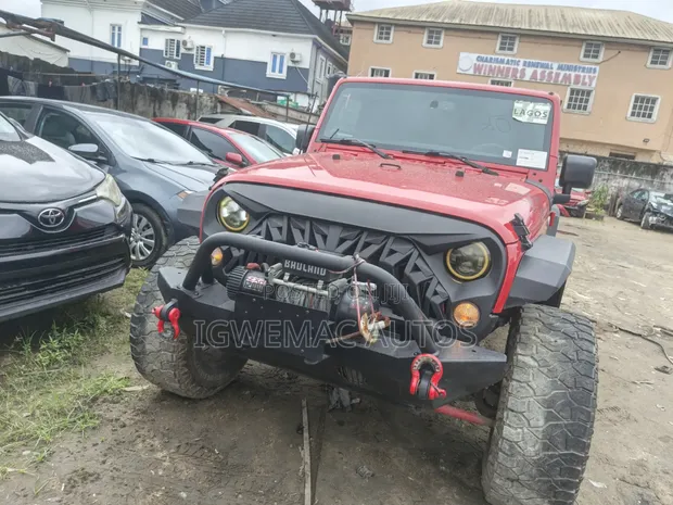 2014 Jeep Wrangler Unlimited Sahara SUV 4WD Red - 1