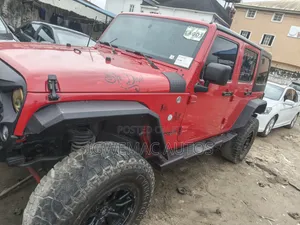 2014 Jeep Wrangler Unlimited Sahara SUV 4WD Red