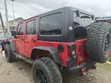 2014 Jeep Wrangler Unlimited Sahara SUV 4WD Red - 4