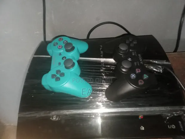 Playstation 3 with 10 Games and 2 Controllers - 1