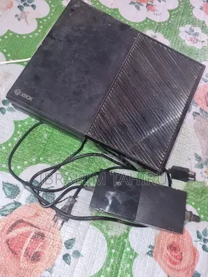 Used Xbox One Console with 8 Games (No Controller)