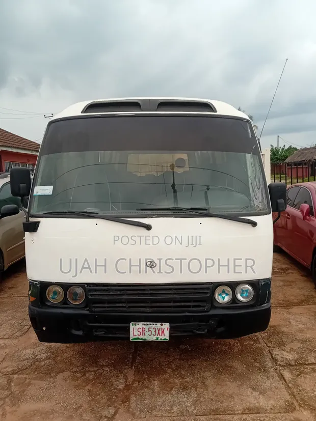 Toyota Coaster 2010 White Bus - 1