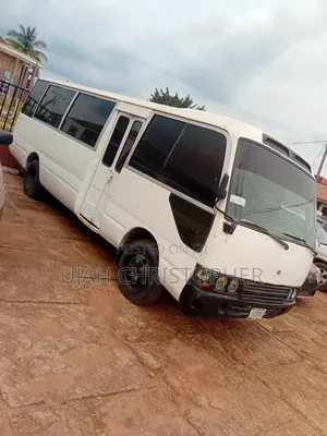 Toyota Coaster 2010 White Bus