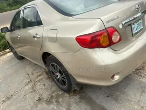 2010 Toyota Corolla LE Sedan Brown