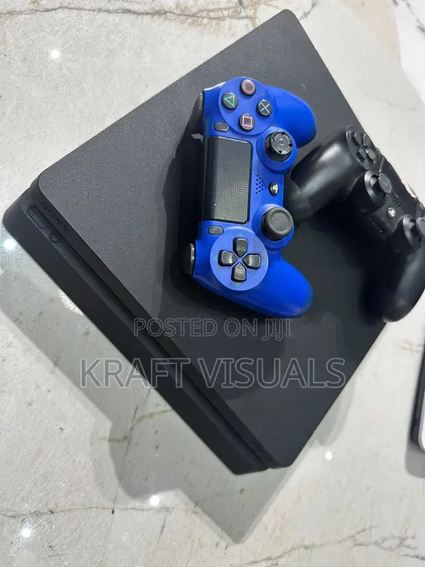 PS4 Slim Console with 2 Controllers and 9 Games - 1