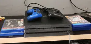 Playstation 4 Pro with 4 Games, 2 Controllers