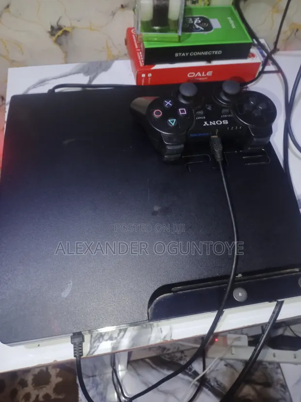 Sony PlayStation 3 Slim (500GB) with 2 Controllers & 14 Games - 1