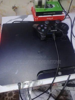 Sony PlayStation 3 Slim (500GB) with 2 Controllers & 14 Games