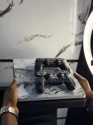 PS4 Slim Console with 11 Games and Controller