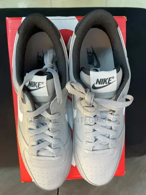 Nike Men's Dunk Low Embossed Big Logo Sneaker