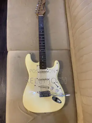 White Fender Stratocaster Electric Guitar