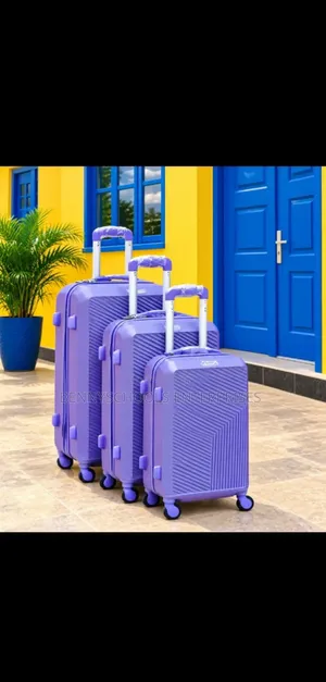 Set of 3 Purple Rubber Luggage Boxes with 4 Wheel Trolleys
