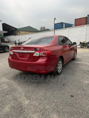 2011 Toyota Corolla LE Sedan - Red
