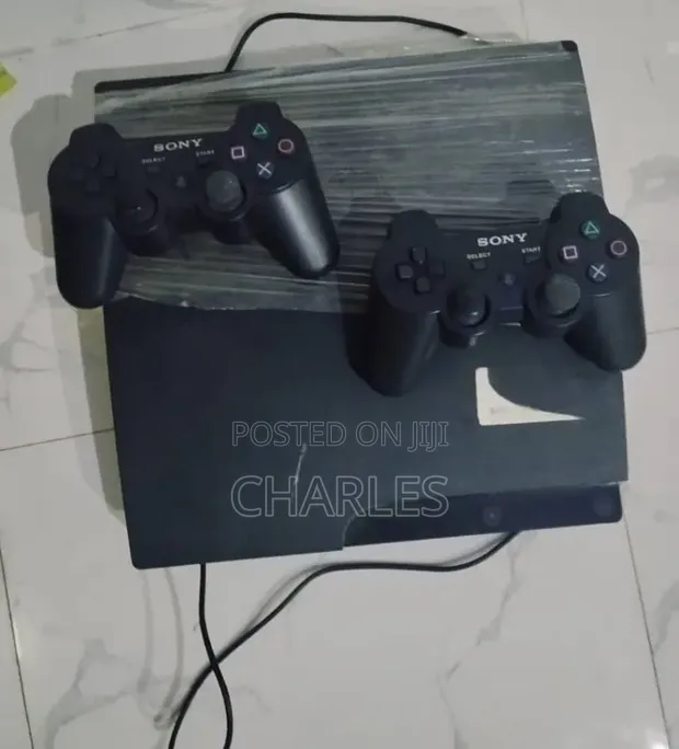 PlayStation 3 with Two Controllers - 1