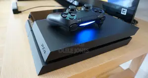 Hacked Sony PlayStation 4 with 8 Games & 2 Controllers